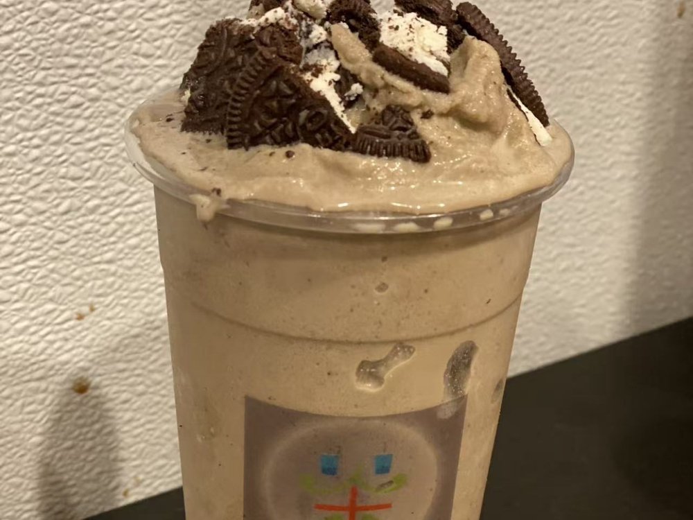 Oreo Matcha Shake topped with crushed Oreo cookies