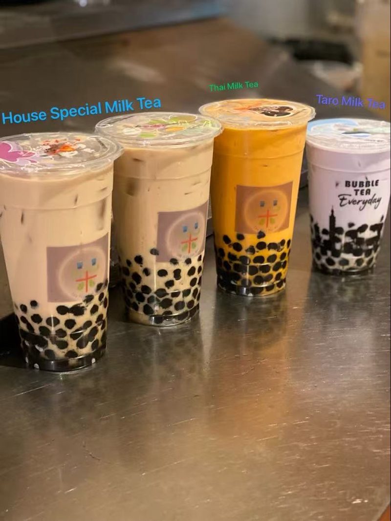 House Special, Thai and Taro milk teas lined up on the counter